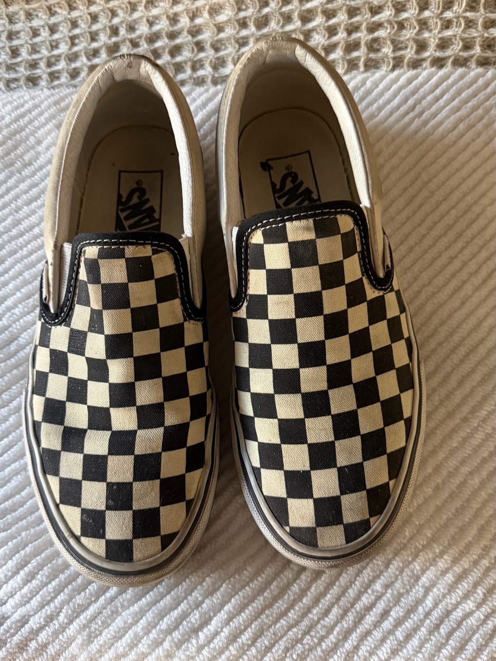 Vans Slip-On Checkerboard Sneakers in Black and white